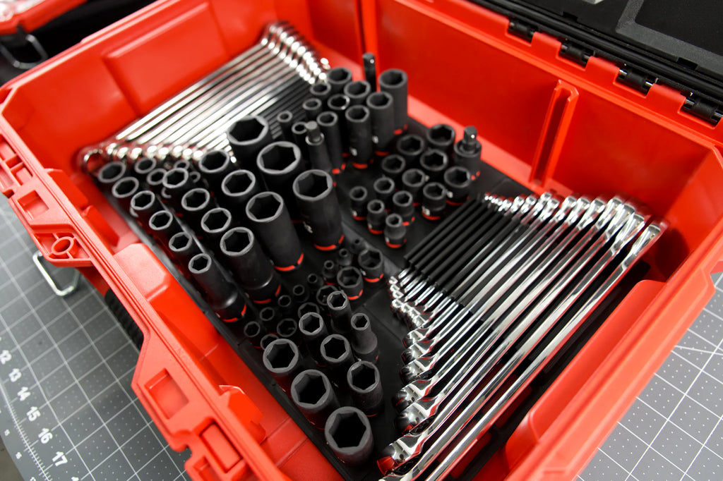 Sockets and wrenches arranged in the red tool box